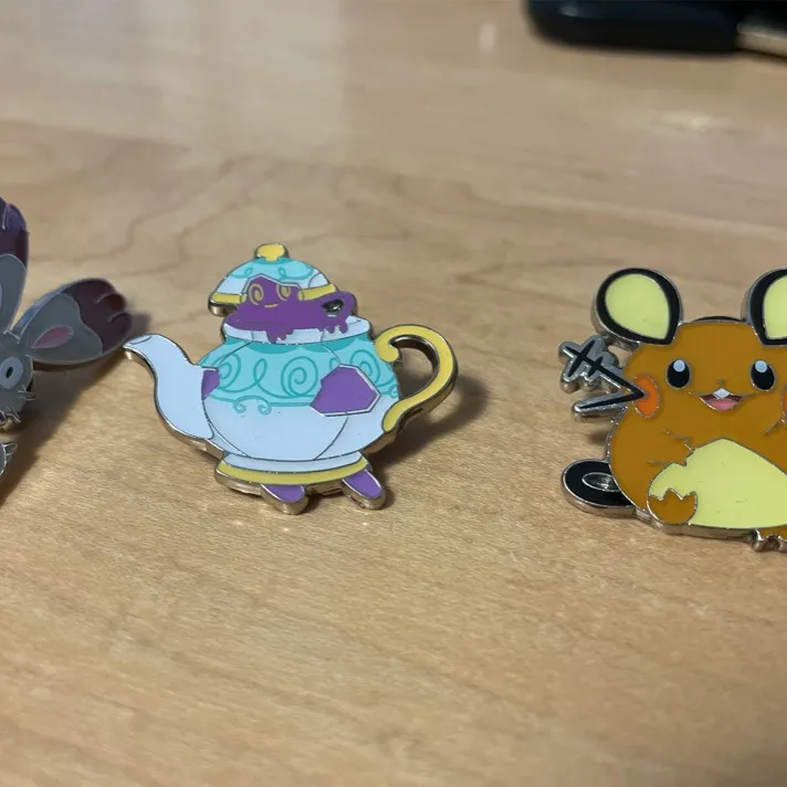 Assorted Pokémon Pins And Coins photo 4