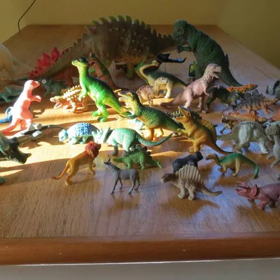 Bunch Of Dinosaur Toys Of Different Sizes And Small Animal To... photo 1
