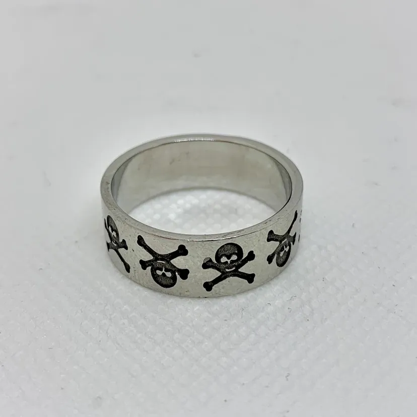 Stainless Steel Ring With Skulls. photo 1