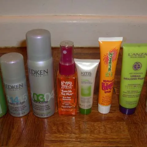A bunch of travel-sized salon hair care products photo 1