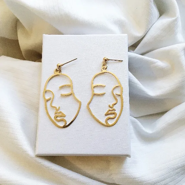 GOLD FACE EARRINGS photo 1