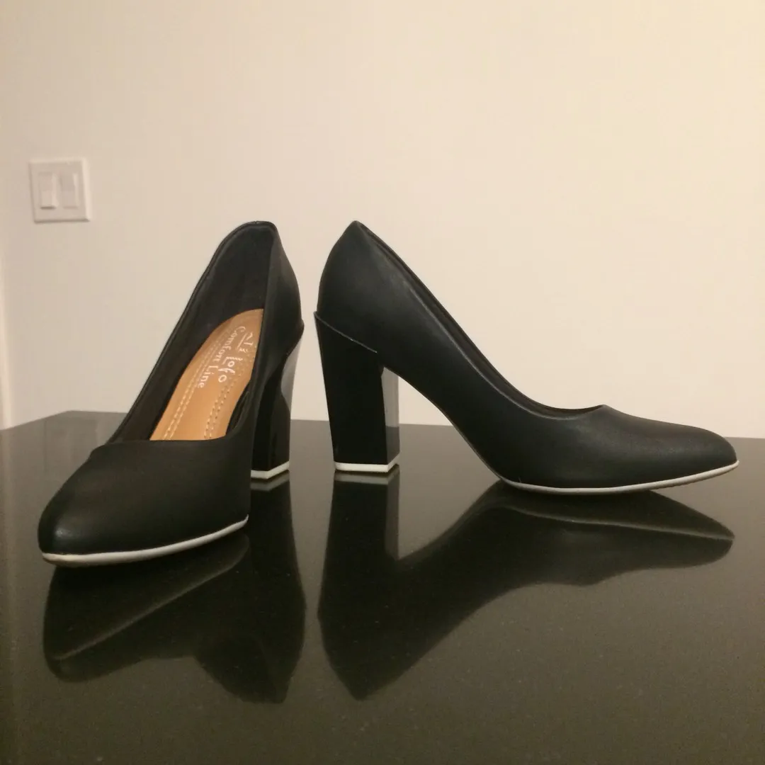 Classic Black Heels With A Twist photo 1