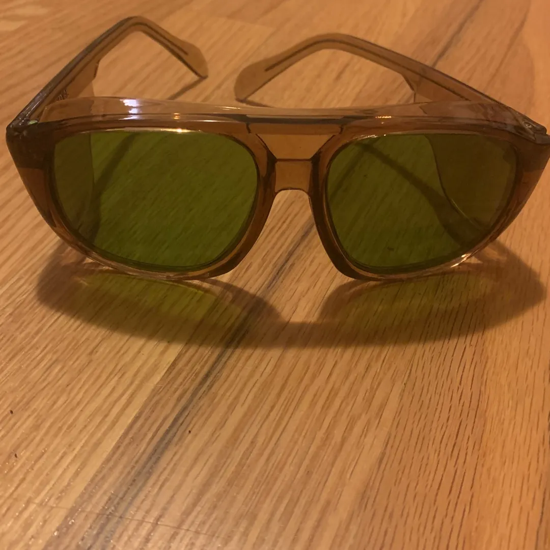 brown and green plastic safety sunglasses photo 1