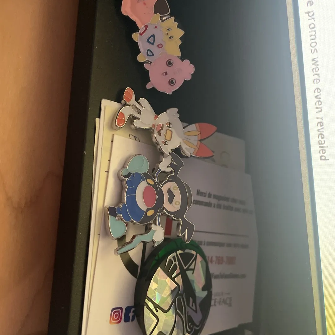 Assorted Pokémon Pins And Coins photo 1