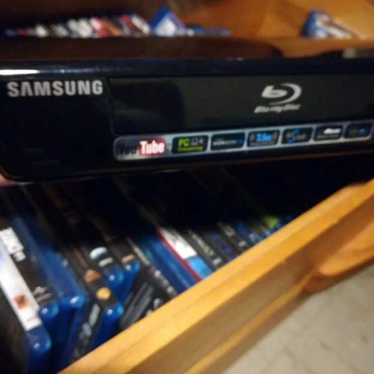 I Gently Used Blue Ray Player With 76 Movies. photo 1