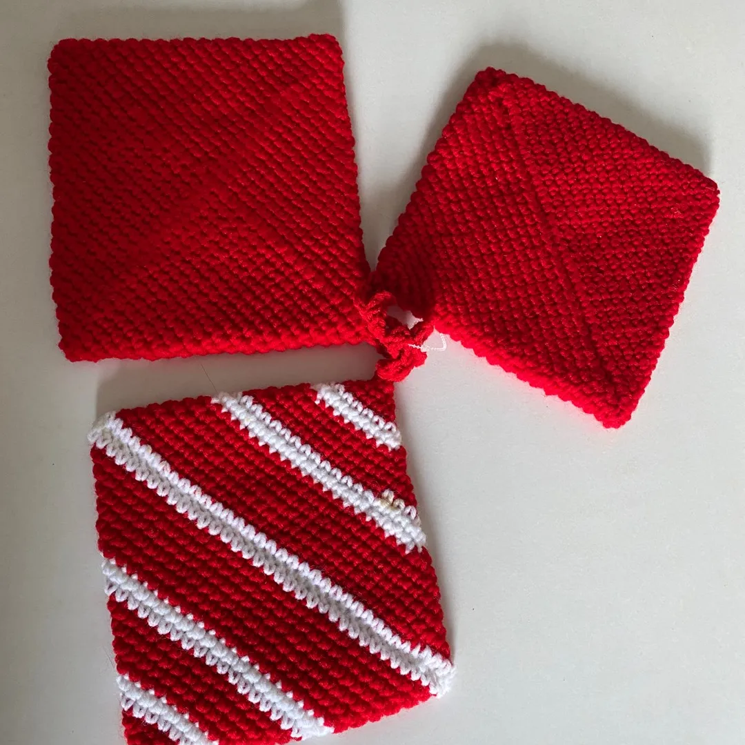 Red and white placemats or potholders, or a knit knitted coas... photo 1