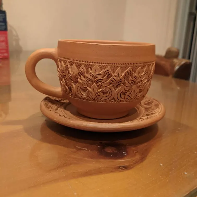 Carved Pottery Tea Cup And Saucer photo 1