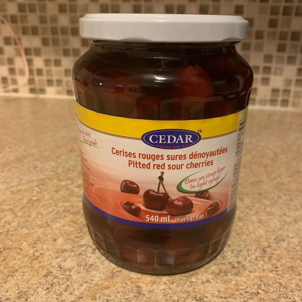 Jar of pitted red sour cherries photo 1