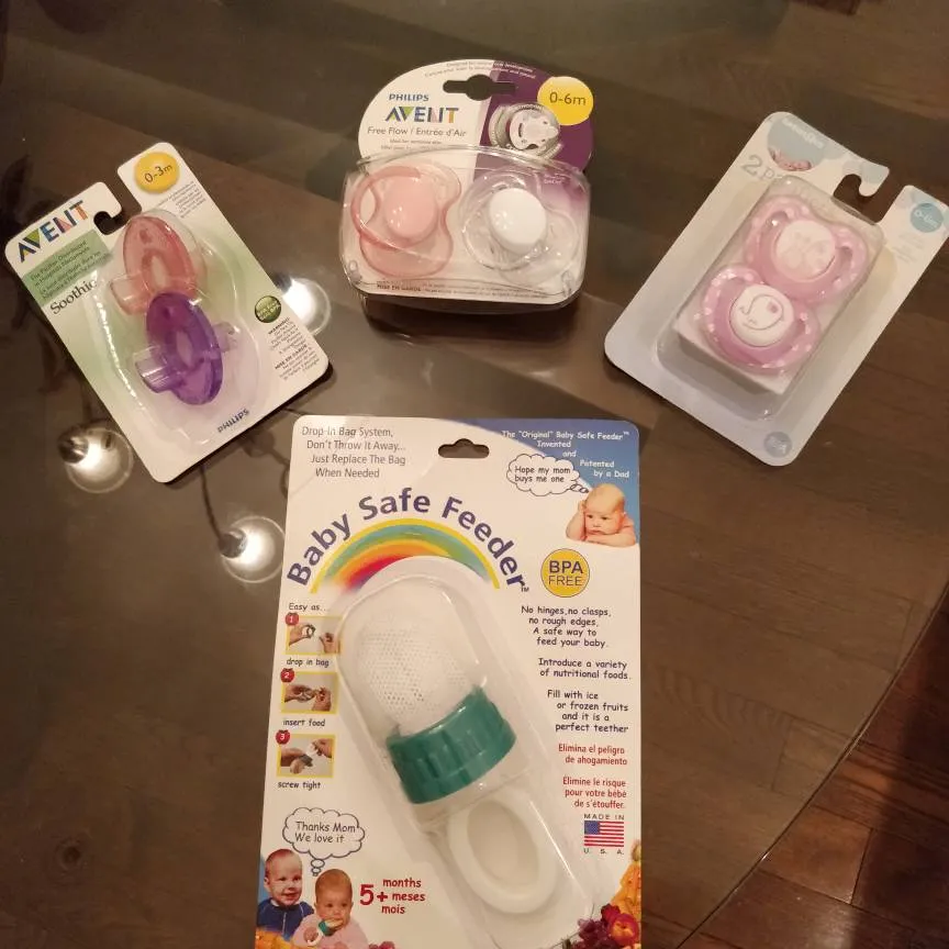 NEW - 3 Packages Of Pacifiers And 1 Baby Feeder! photo 1