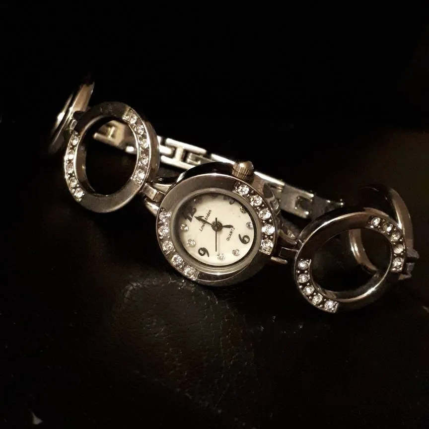 silver watch photo 1