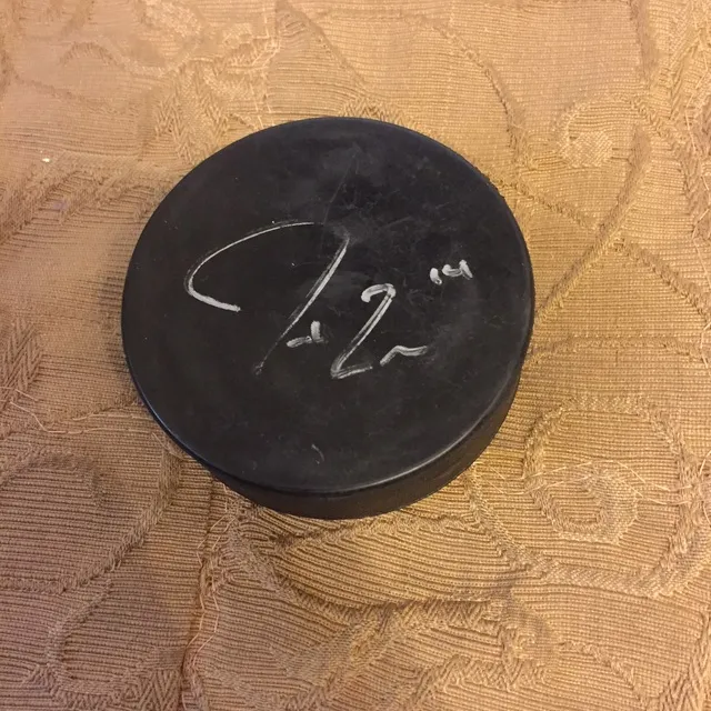 Signed Jordan Eberle Hockey Puck photo 1