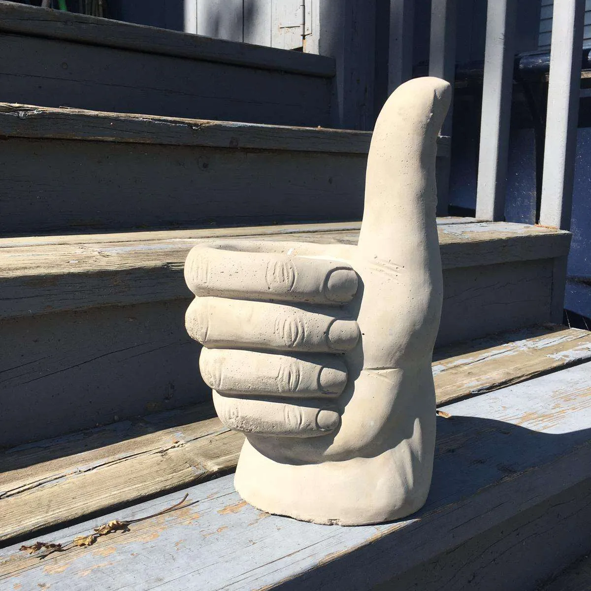 Concrete thumbs up candle - never been used photo 1