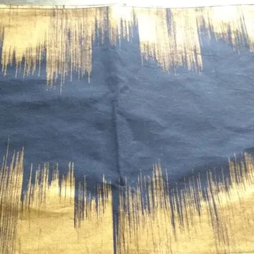 Four West Elm placemats in navy and gold print photo 1