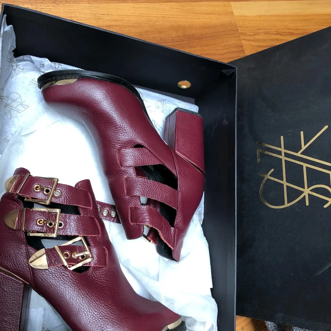 Maroon Booties With Gold Detailing photo 1