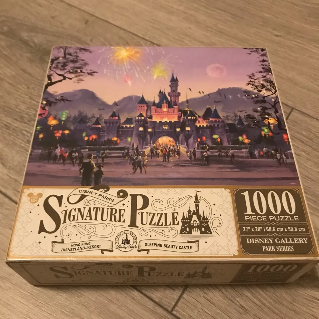 Never Opened Disney 1000 Piece Signature Puzzle photo 1
