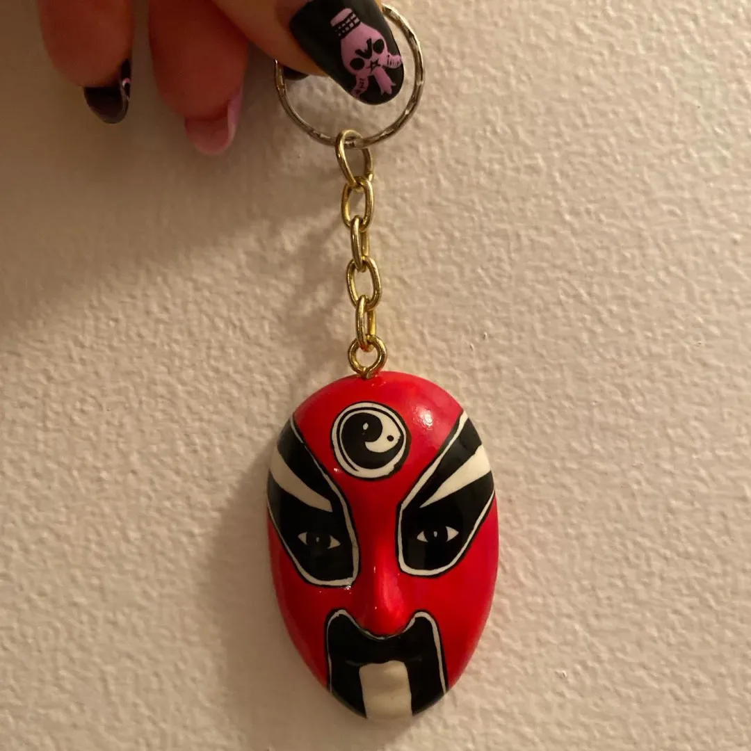 Chinese face keychain, featuring a red black white fierce war... photo 1