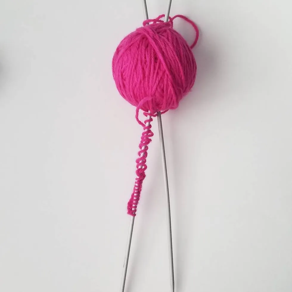 Knitting Needles + Hot Pink Yarn photo 1