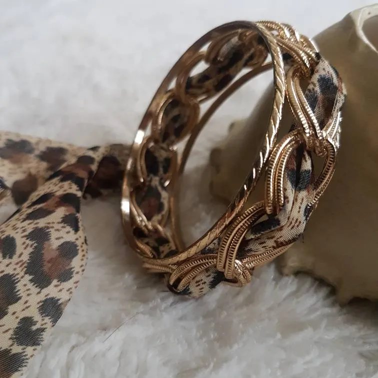 BEAUTIFUL GOLD BRACELET WRAPPED WITH CHIC ANIMAL PRINT MATERIAL photo 1