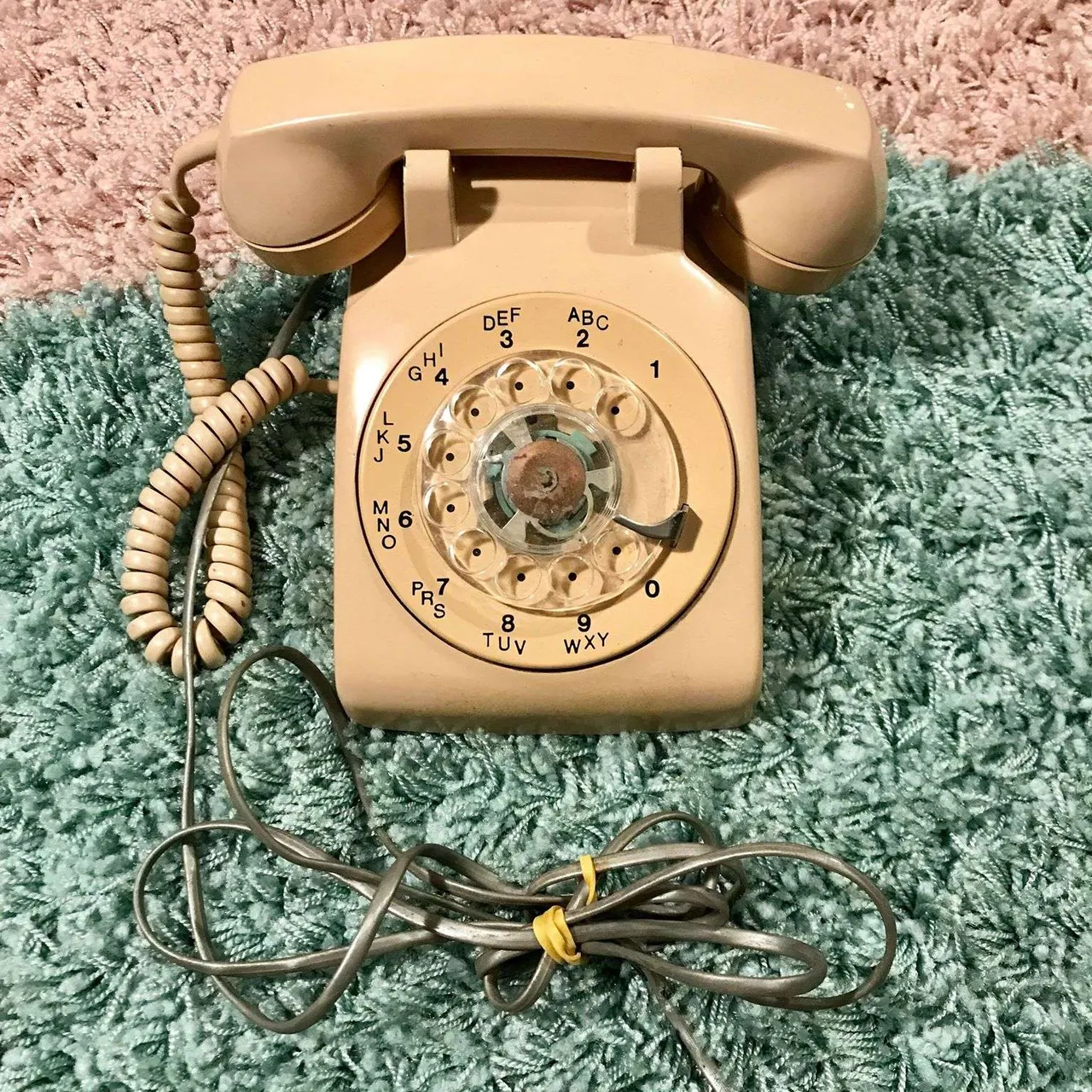 vintage pink-ish rotary phone photo 1